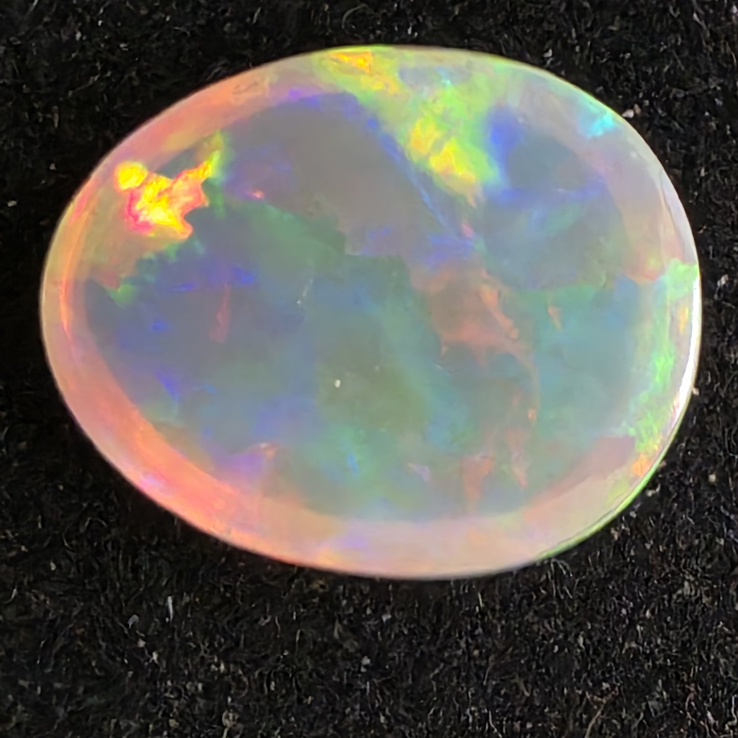 Black Opal special Ethiopian Welo, 7 ct pear polished, natural, intense Play-of-Colour