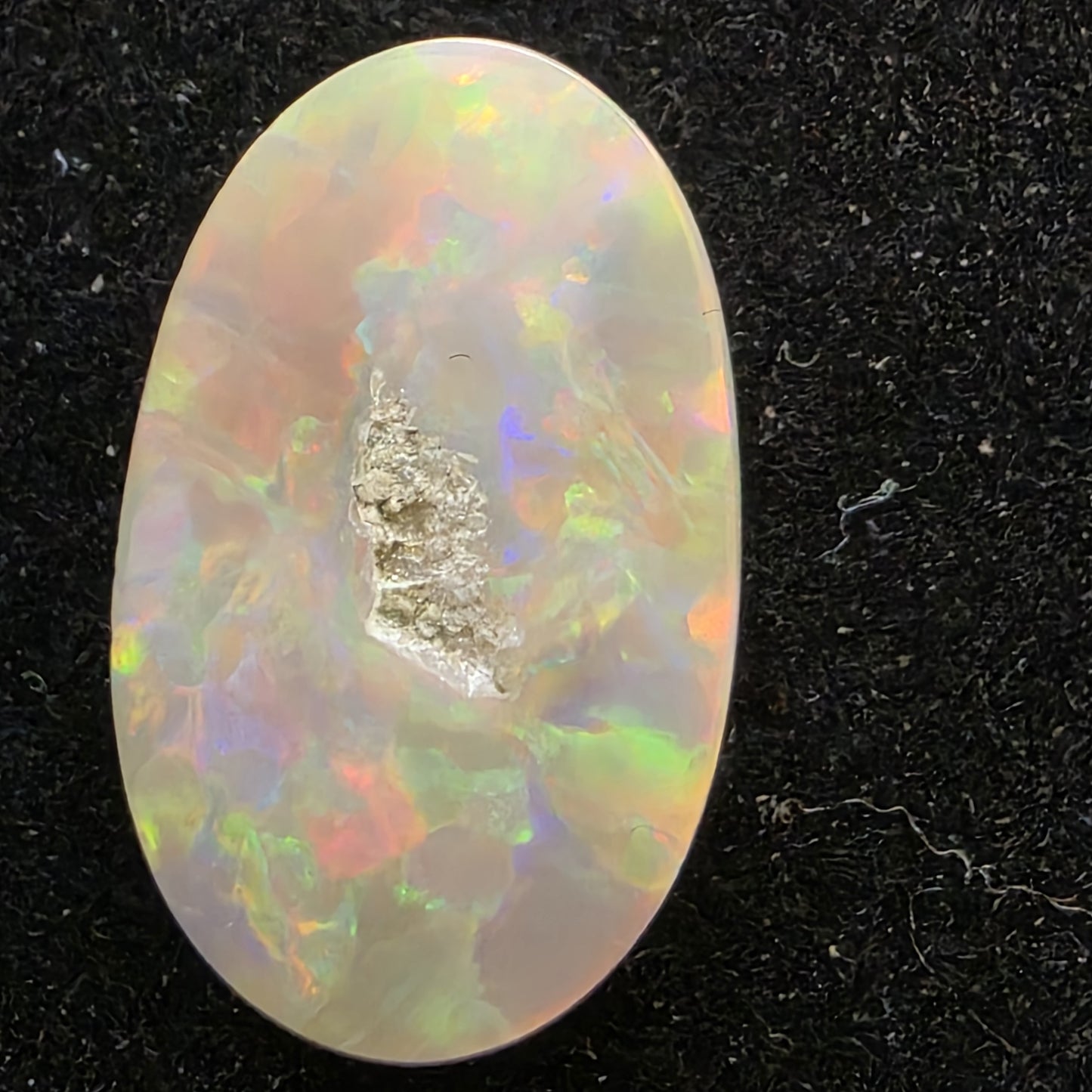 Black Opal special Ethiopian Welo, 6.55 ct oval polished, natural, intense Play-of-Colour