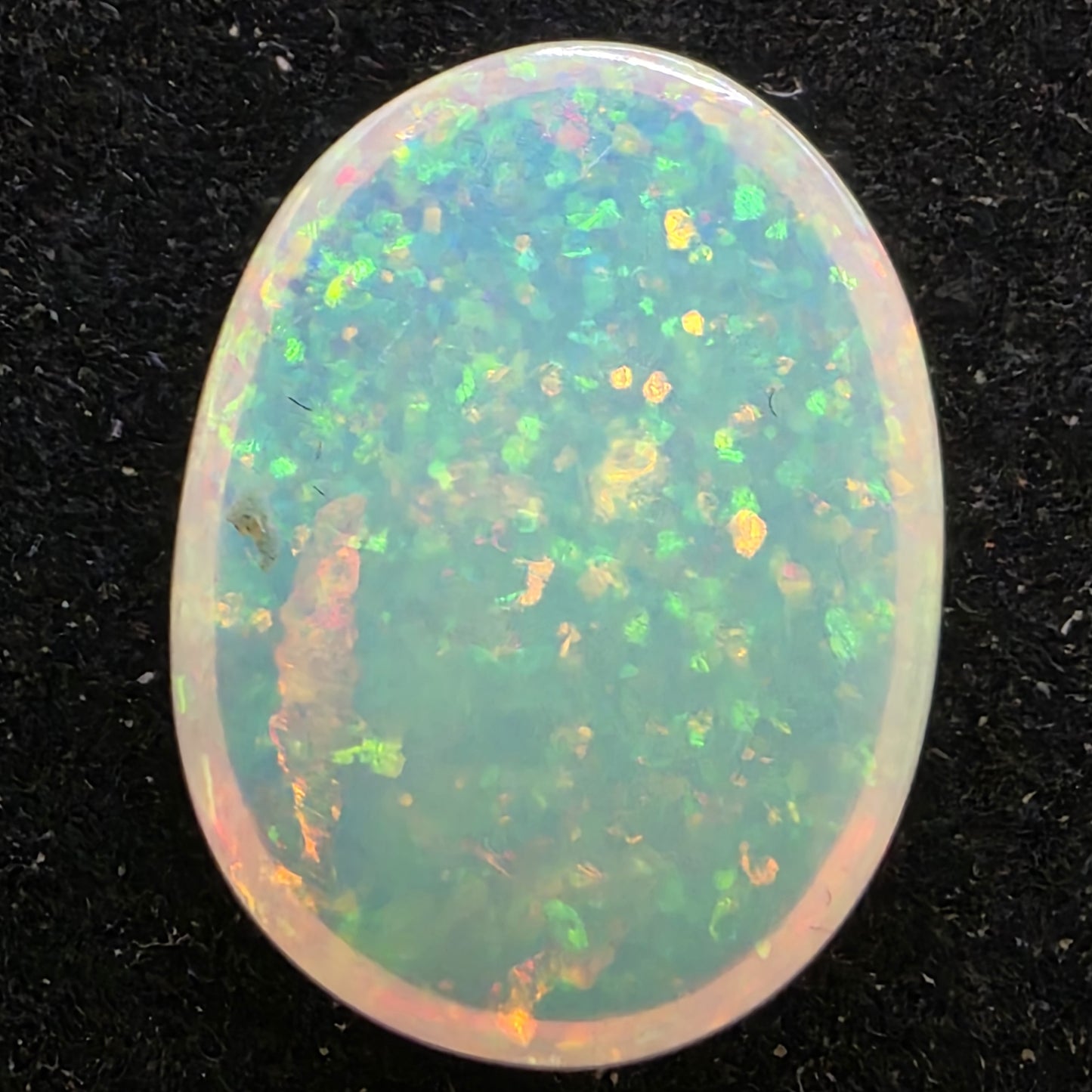 White Opal special Ethiopian Welo, 6.7 ct oval polished, natural, intense Play-of-Colour