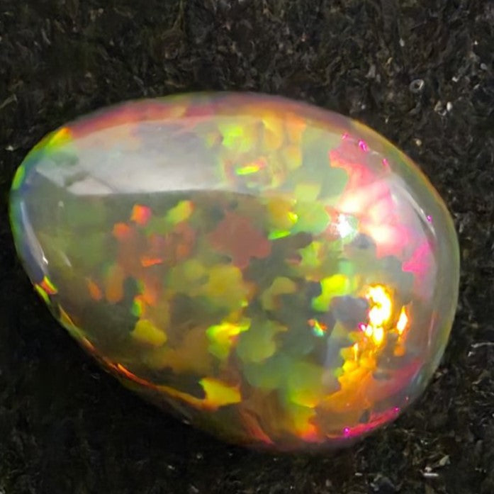 Black Opal special Ethiopian Welo, 2.75 ct pear polished, natural, intense Play-of-Colour