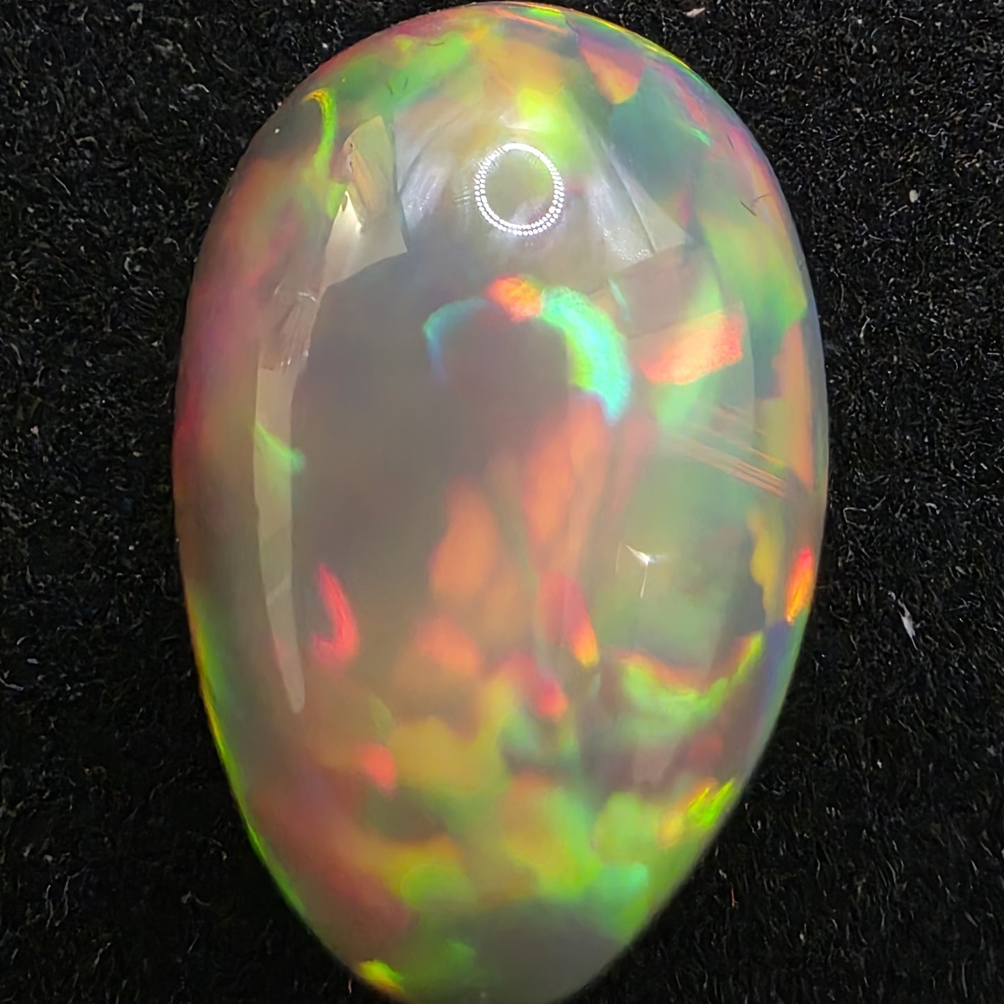 Black Opal special Ethiopian Welo, 9.45 ct pear polished, natural, intense Play-of-Colour