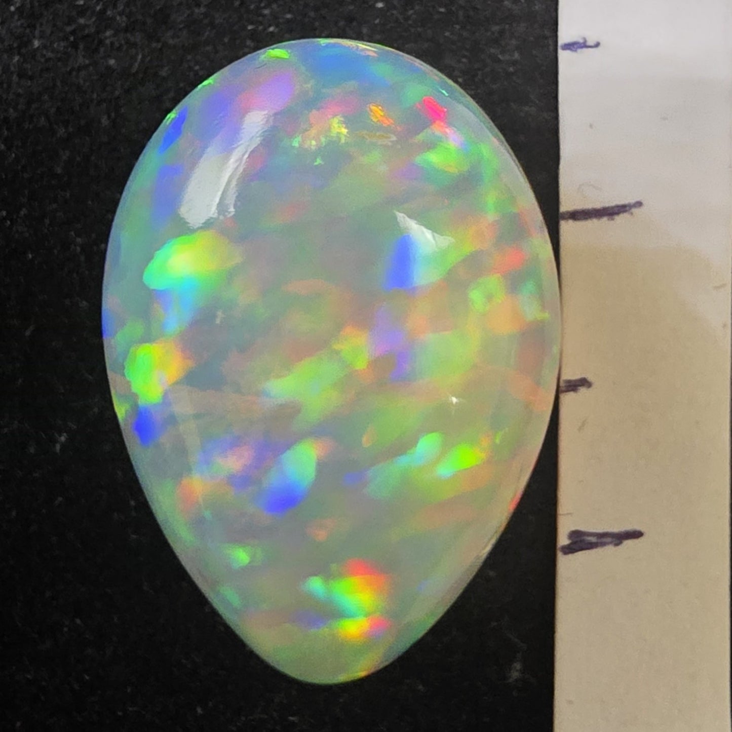 White Opal special Ethiopian Welo, 8.5 ct pear polished, natural, intense Play-of-Colour