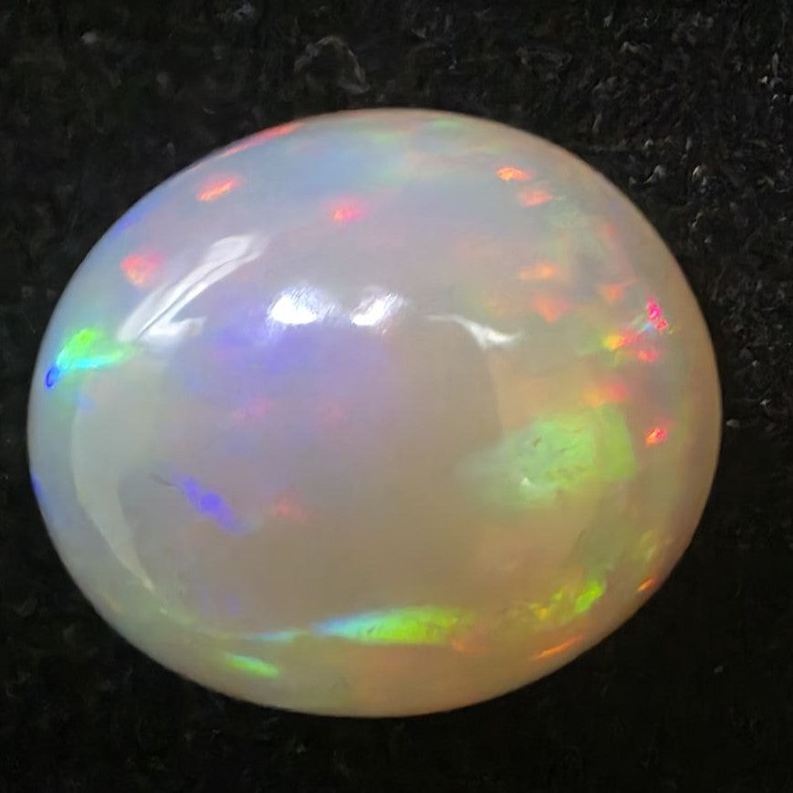 Black Opal special Ethiopian Welo, 7.25 ct oval polished, natural, intense Play-of-Colour