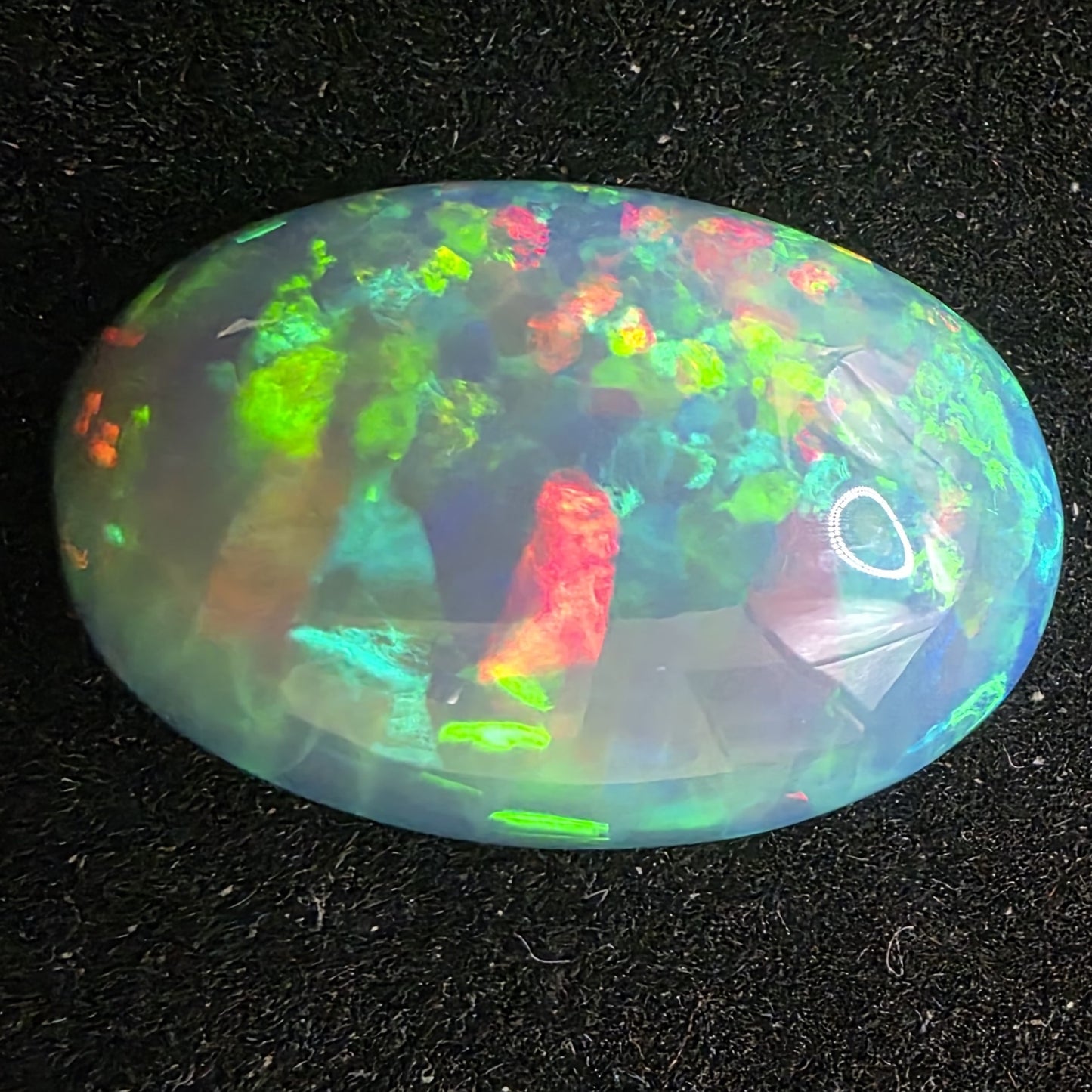 Honeycomb Black Opal special Ethiopian Welo, 8.05 ct oval polished, natural, intense Play-of-Colour