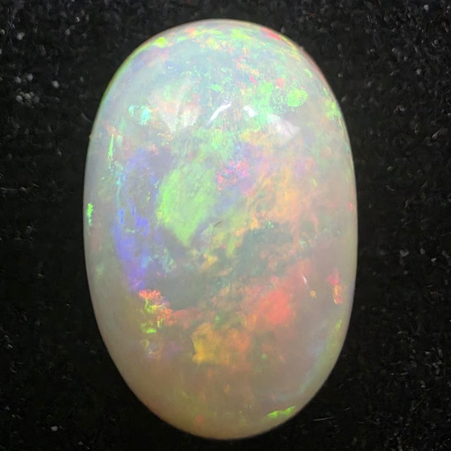 White Opal special Ethiopian Welo, 5.8 ct oval polished, natural, intense Play-of-Colour