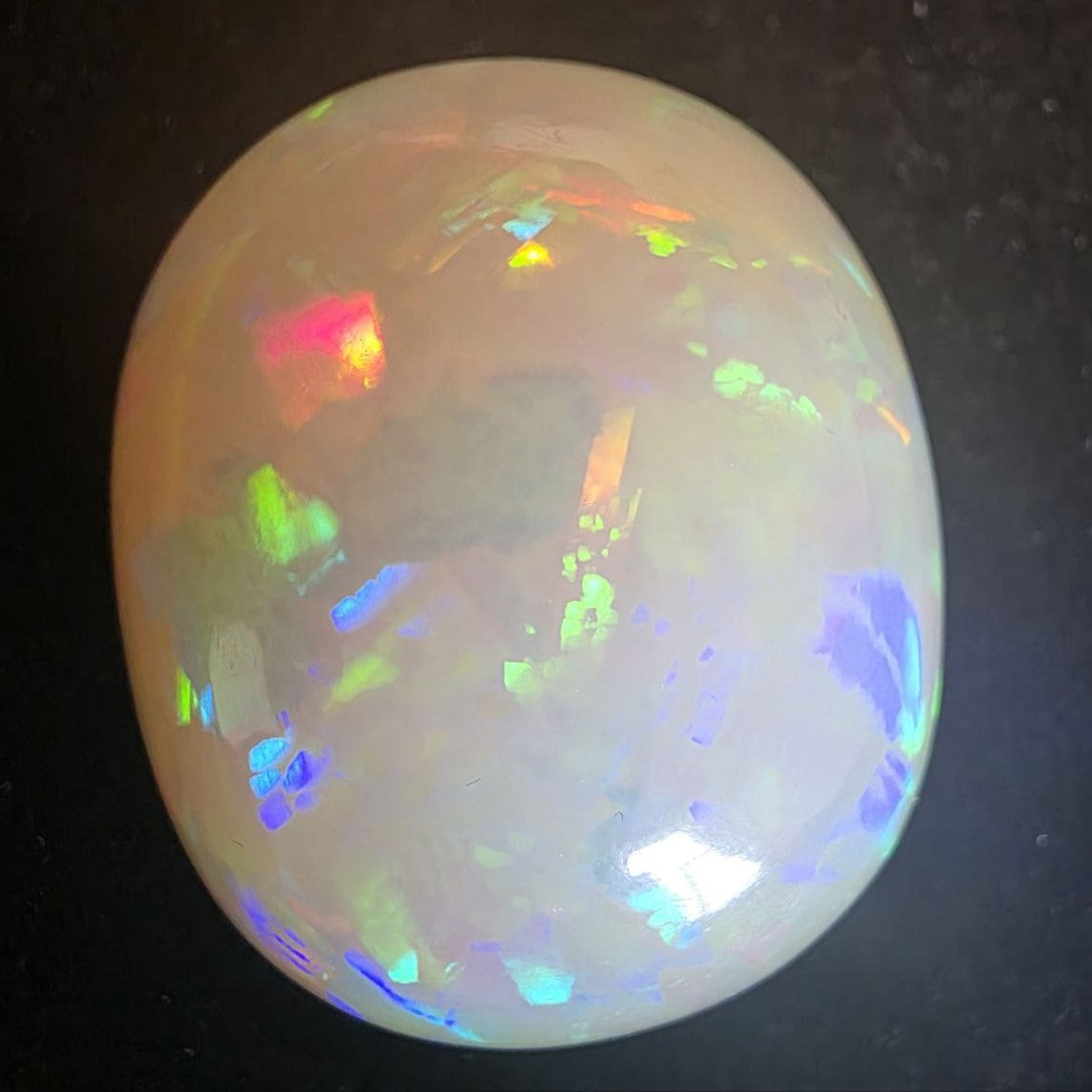 BIG stone! White Opal special Ethiopian Welo, 71.3 ct oval polished, natural, intense Play-of-Colour