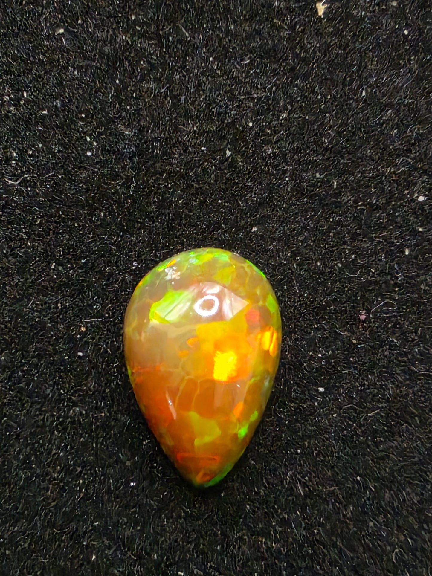 Black Opal special Ethiopian Welo, 2.1 ct pear polished, natural, intense Play-of-Colour