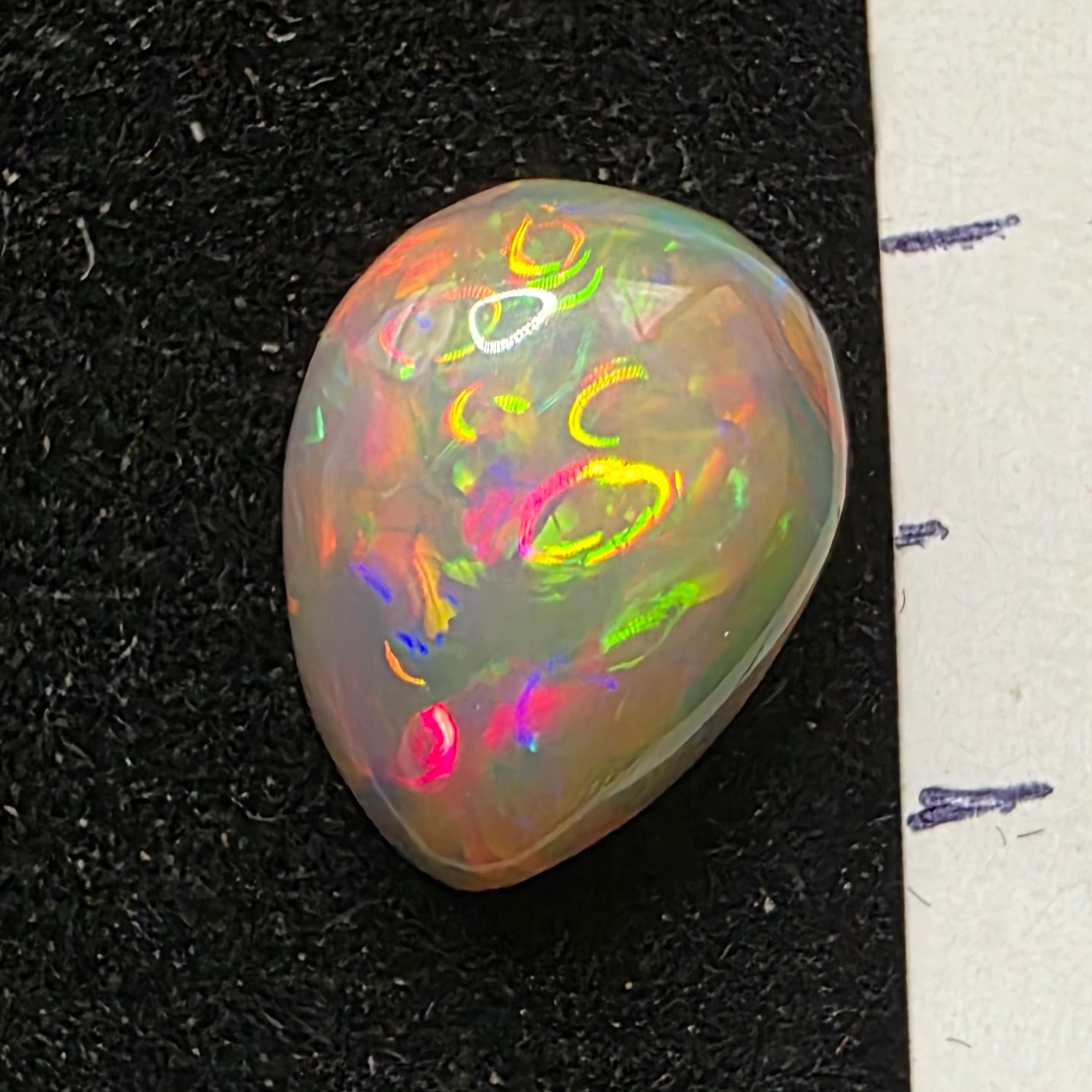 Black Opal special Ethiopian Welo, 2.65 ct pear polished, natural, intense Play-of-Colour