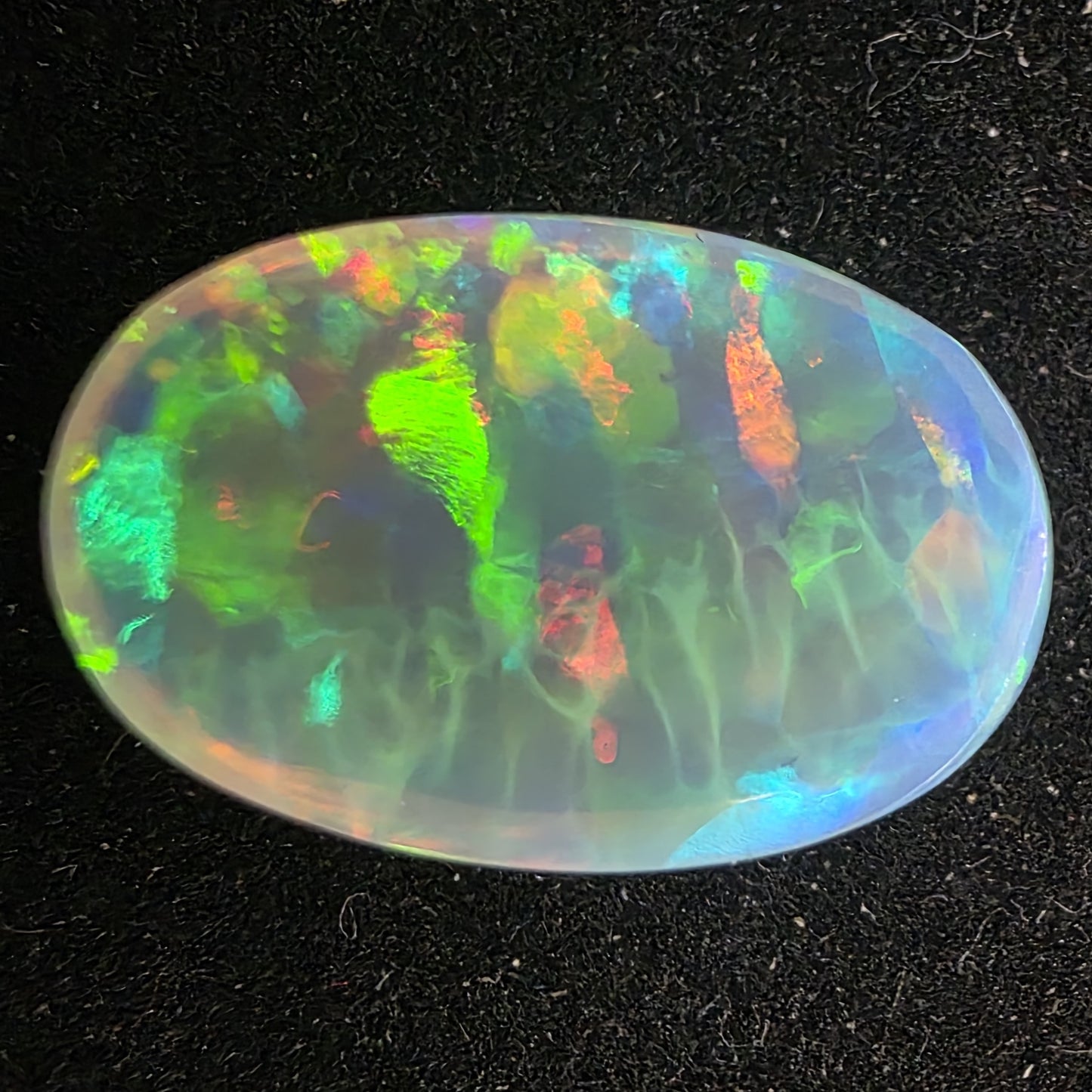 Honeycomb Black Opal special Ethiopian Welo, 8.05 ct oval polished, natural, intense Play-of-Colour