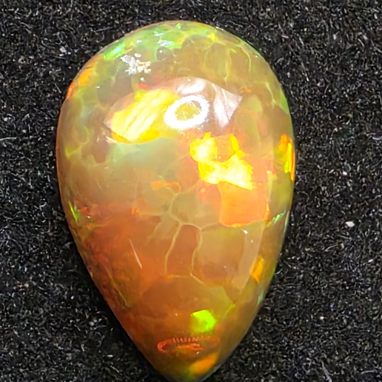 Black Opal special Ethiopian Welo, 2.1 ct pear polished, natural, intense Play-of-Colour