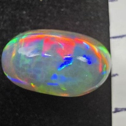 Black Opal special Ethiopian Welo, 4.8 ct oval polished, natural, intense Play-of-Colour