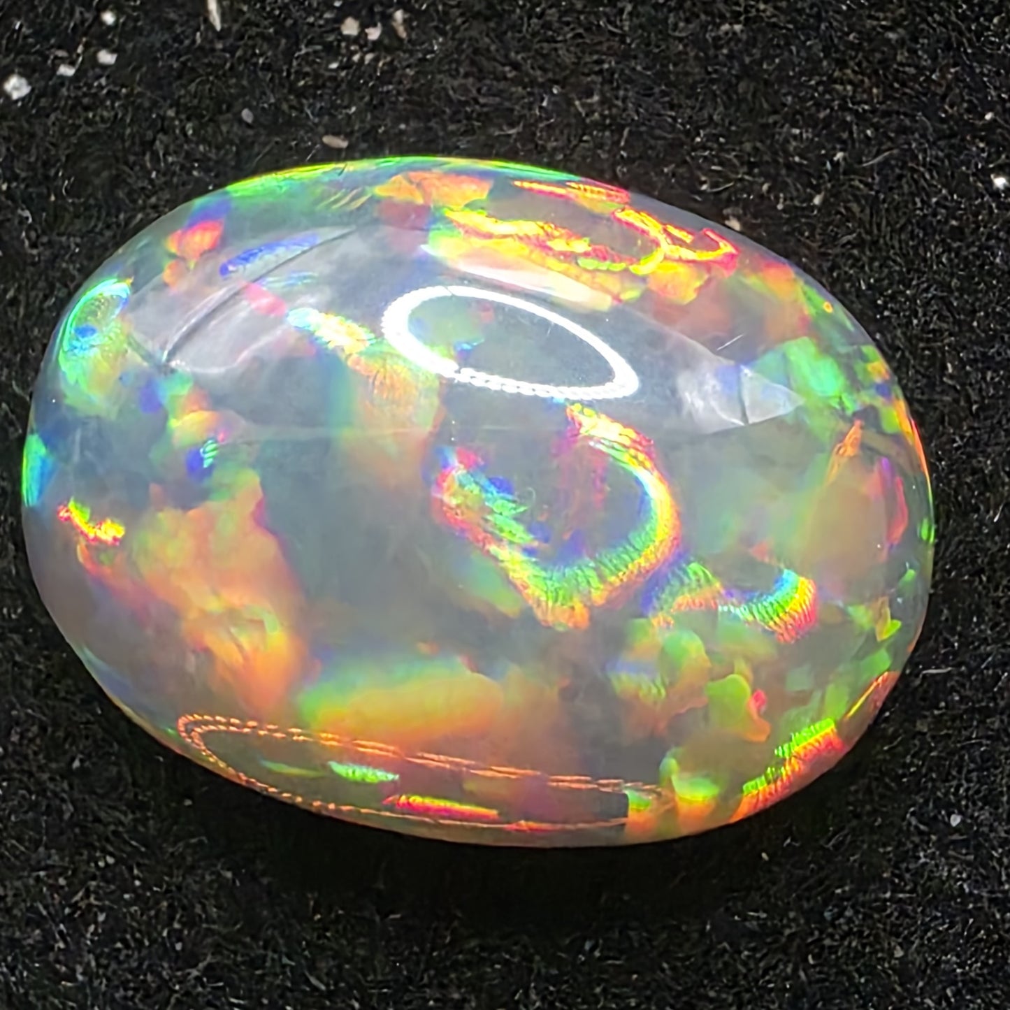 Black Opal special Ethiopian Welo, 5.4 ct oval polished, natural, intense Play-of-Colour