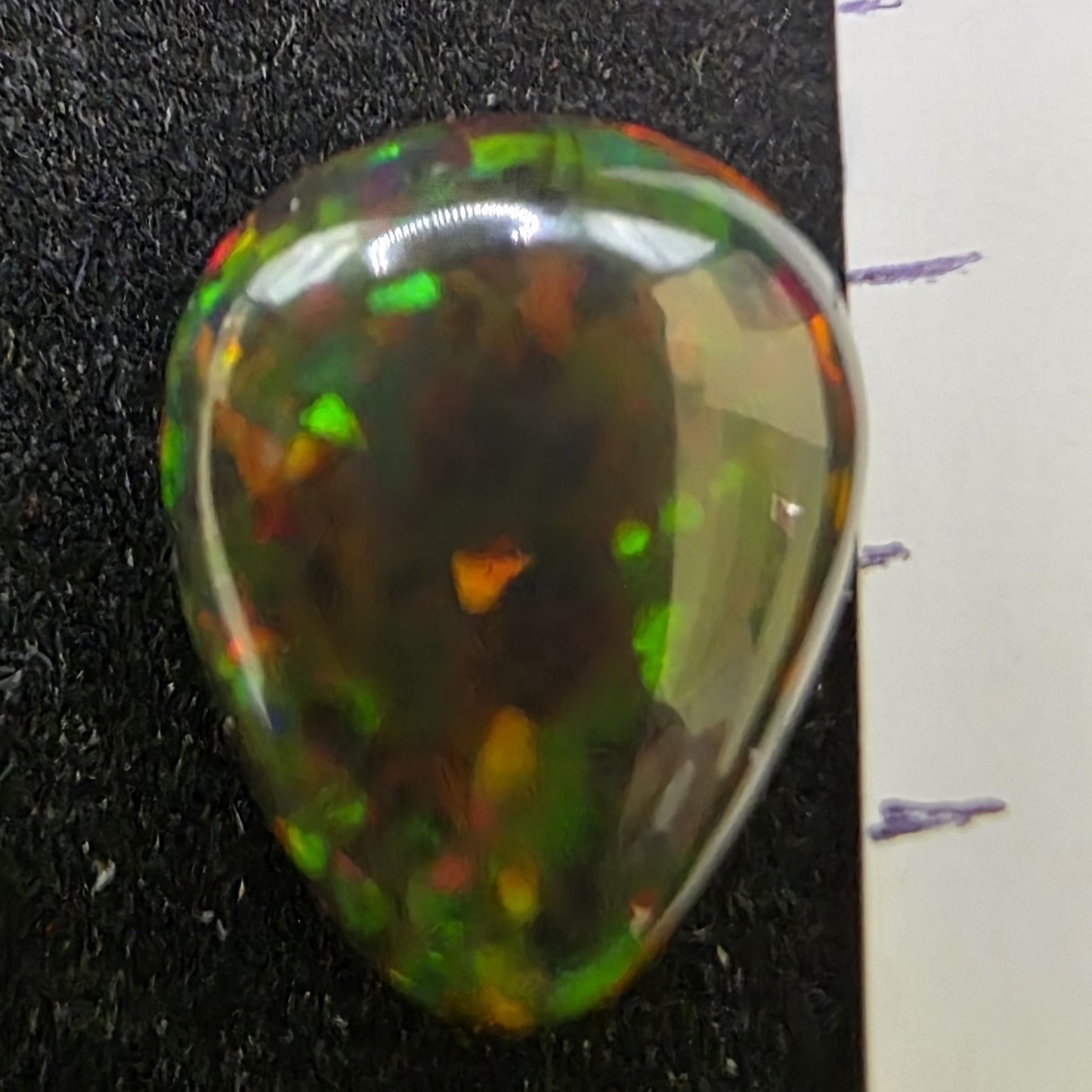 Black Opal special Ethiopian Welo, 5.9 ct pear polished, natural, intense Play-of-Colour