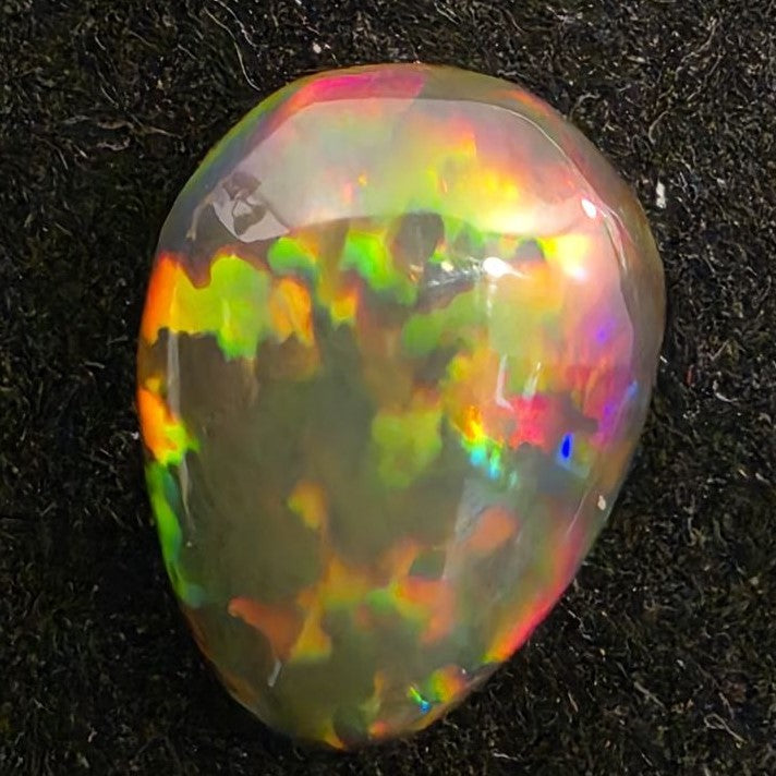 Black Opal special Ethiopian Welo, 2.75 ct pear polished, natural, intense Play-of-Colour