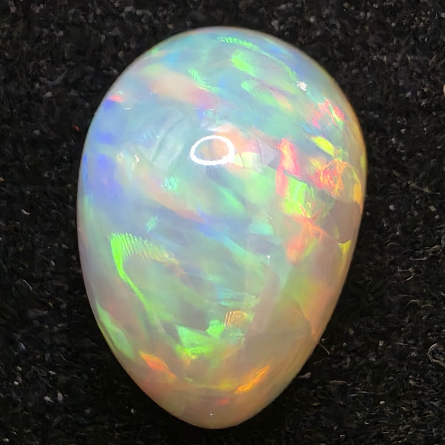 White Opal special Ethiopian Welo, 6.7 ct freeform polished, natural, intense Play-of-Colour