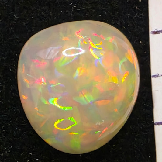 Honey Opal special Ethiopian Welo, 6.4 ct freeform polished, natural, intense Play-of-Colour