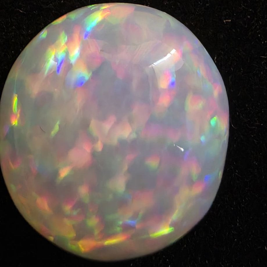 White Opal special Ethiopian Welo, 8.55 ct round polished, natural, intense Play-of-Colour