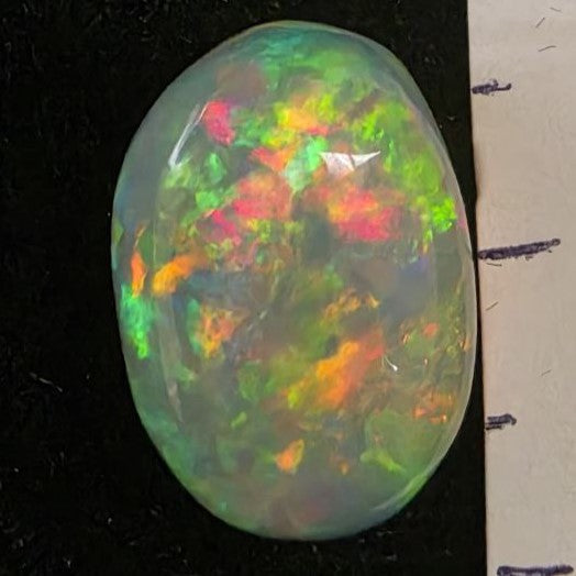 Black Opal special Ethiopian Welo, 5 ct oval polished, natural, intense Play-of-Colour