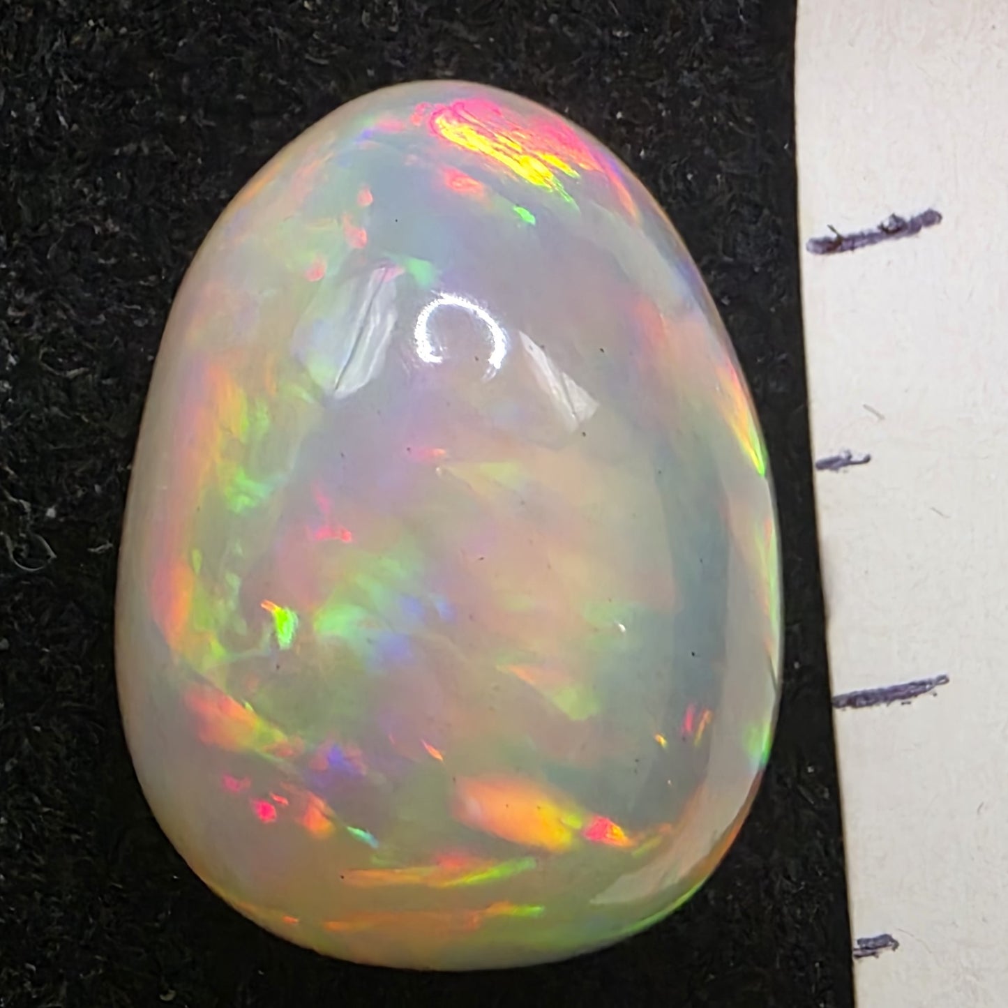 Black Opal special Ethiopian Welo, 11.5 ct pear polished, natural, intense Play-of-Colour