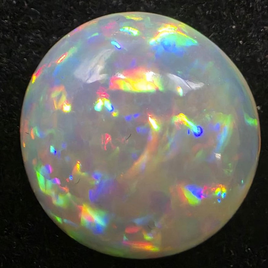 Black Opal special Ethiopian Welo, 5 ct round polished, natural, intense Play-of-Colour