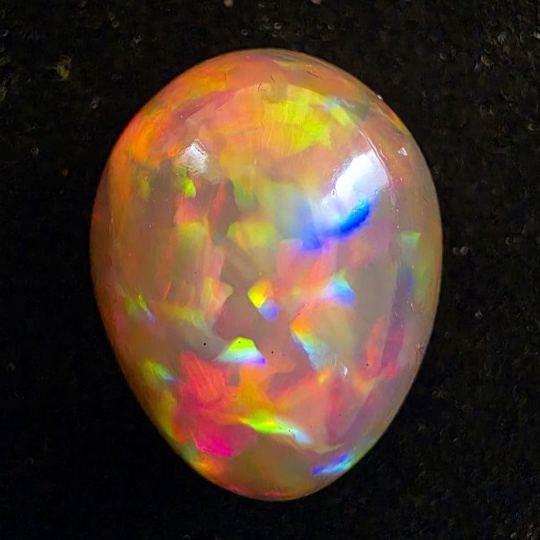 Black Opal special Ethiopian Welo, 14.35 ct pear polished, natural, intense Play-of-Colour