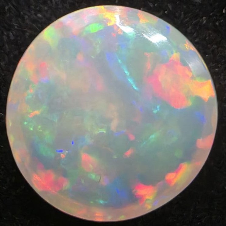 Black Opal special Ethiopian Welo, 5 ct round polished, natural, intense Play-of-Colour