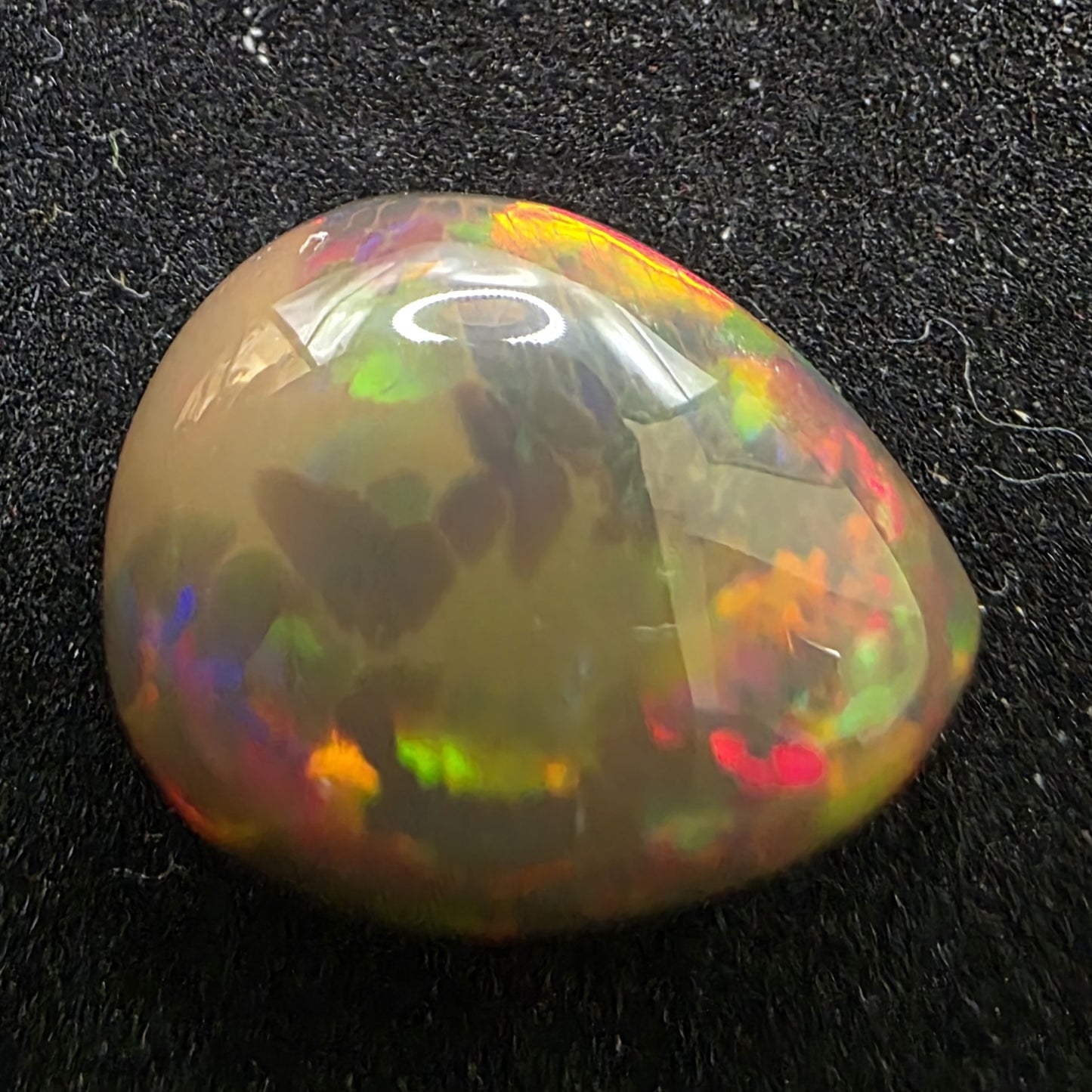 Black Opal special Ethiopian Welo, 7.2 ct pear polished, natural, intense Play-of-Colour
