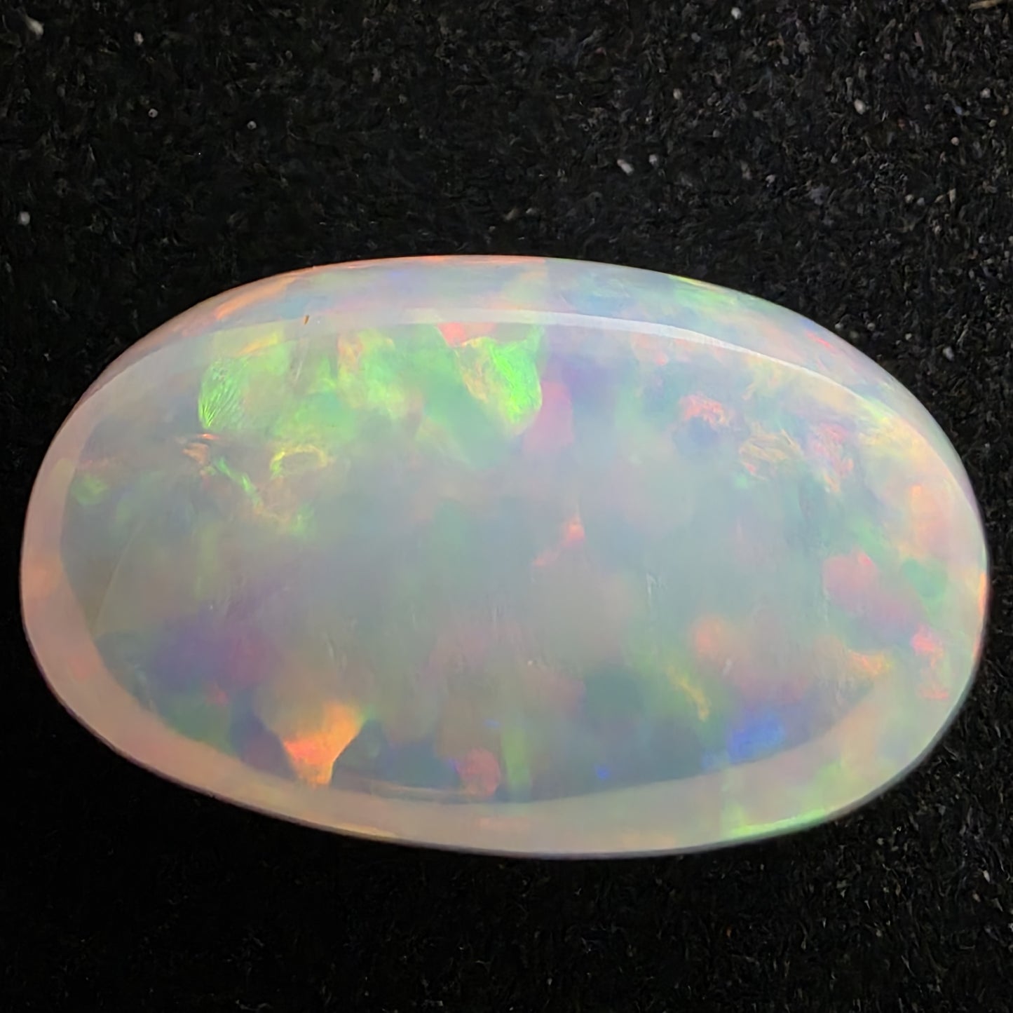 White Opal special Ethiopian Welo, 13.05 ct oval polished, natural, intense Play-of-Colour