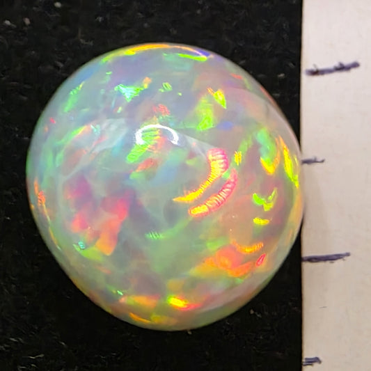 Honeycomb White Opal special Ethiopian Welo, 8.7 ct freeform polished, natural, intense Play-of-Colour