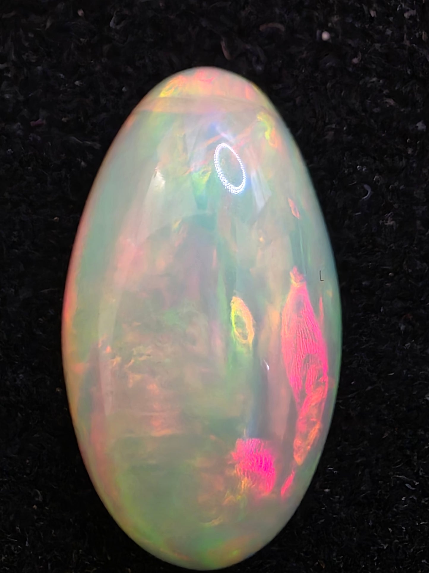 White Opal special Ethiopian Welo, 6.9 ct oval polished, natural, intense Play-of-Colour