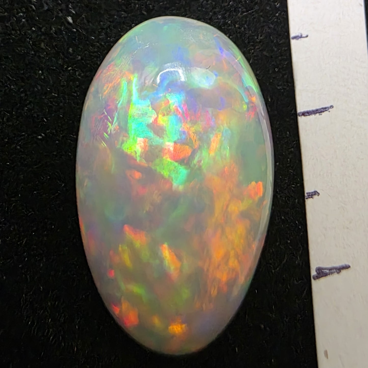 White Opal special Ethiopian Welo, 8.9 ct pear polished, natural, intense Play-of-Colour