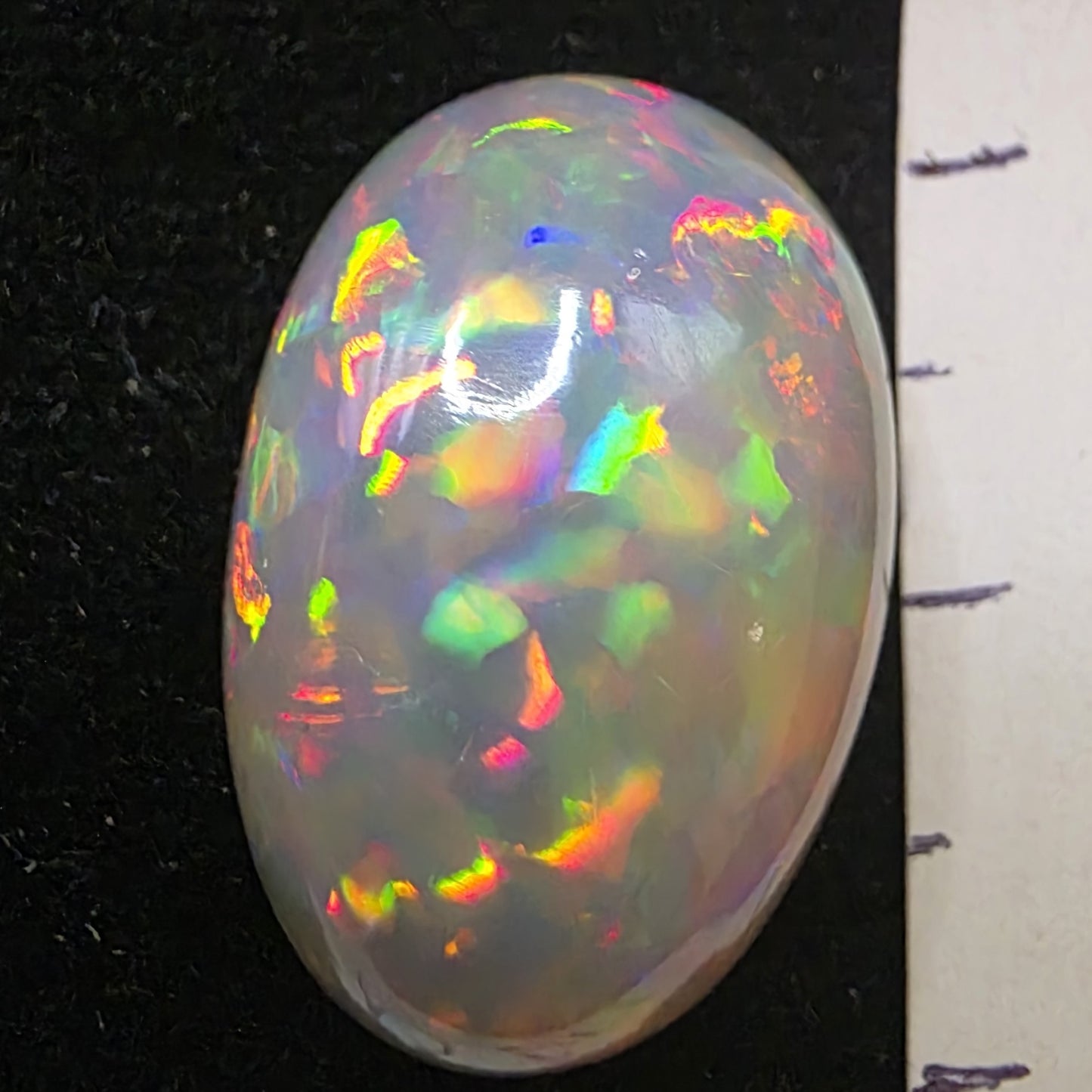 Black Opal special Ethiopian Welo, 12.1 ct oval polished, natural, intense Play-of-Colour
