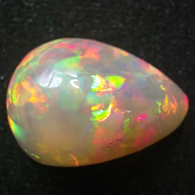 Black Opal special Ethiopian Welo, 23.55 ct pear polished, natural, intense Play-of-Colour