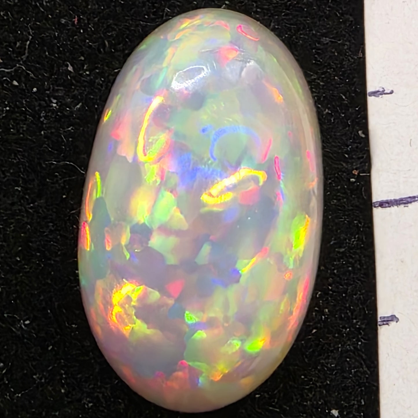 Black Opal special Ethiopian Welo, 6.55 ct oval polished, natural, intense Play-of-Colour