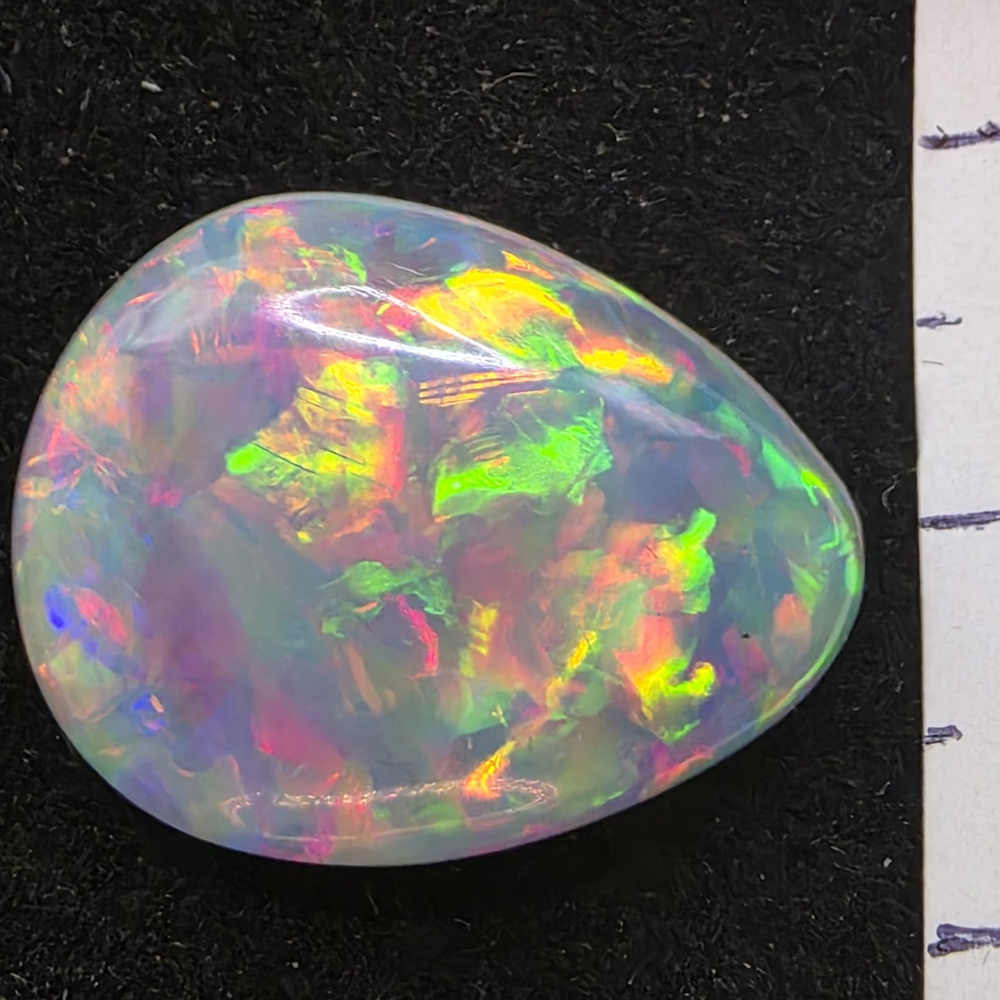 White Opal special Ethiopian Welo, 11 ct pear polished, natural, intense Play-of-Colour