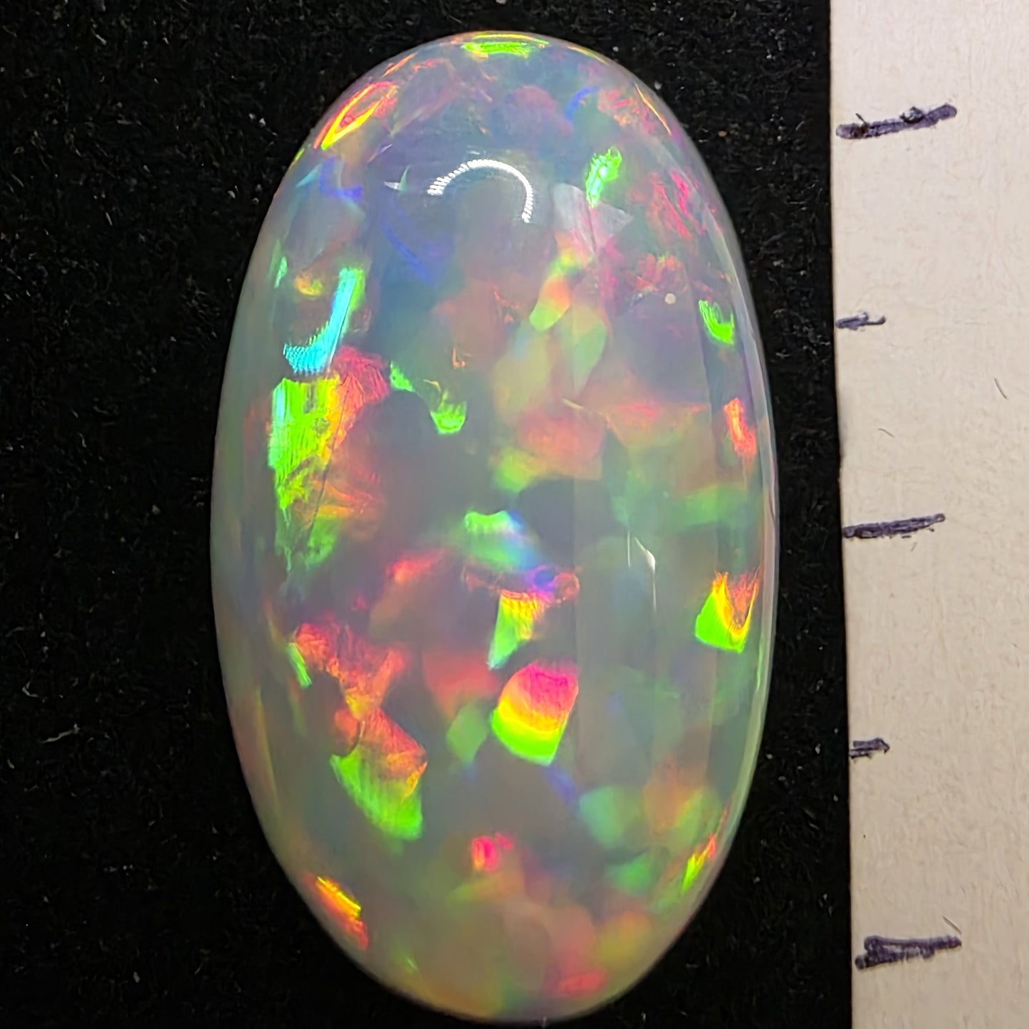 White Opal special Ethiopian Welo, 13.05 ct oval polished, natural, intense Play-of-Colour