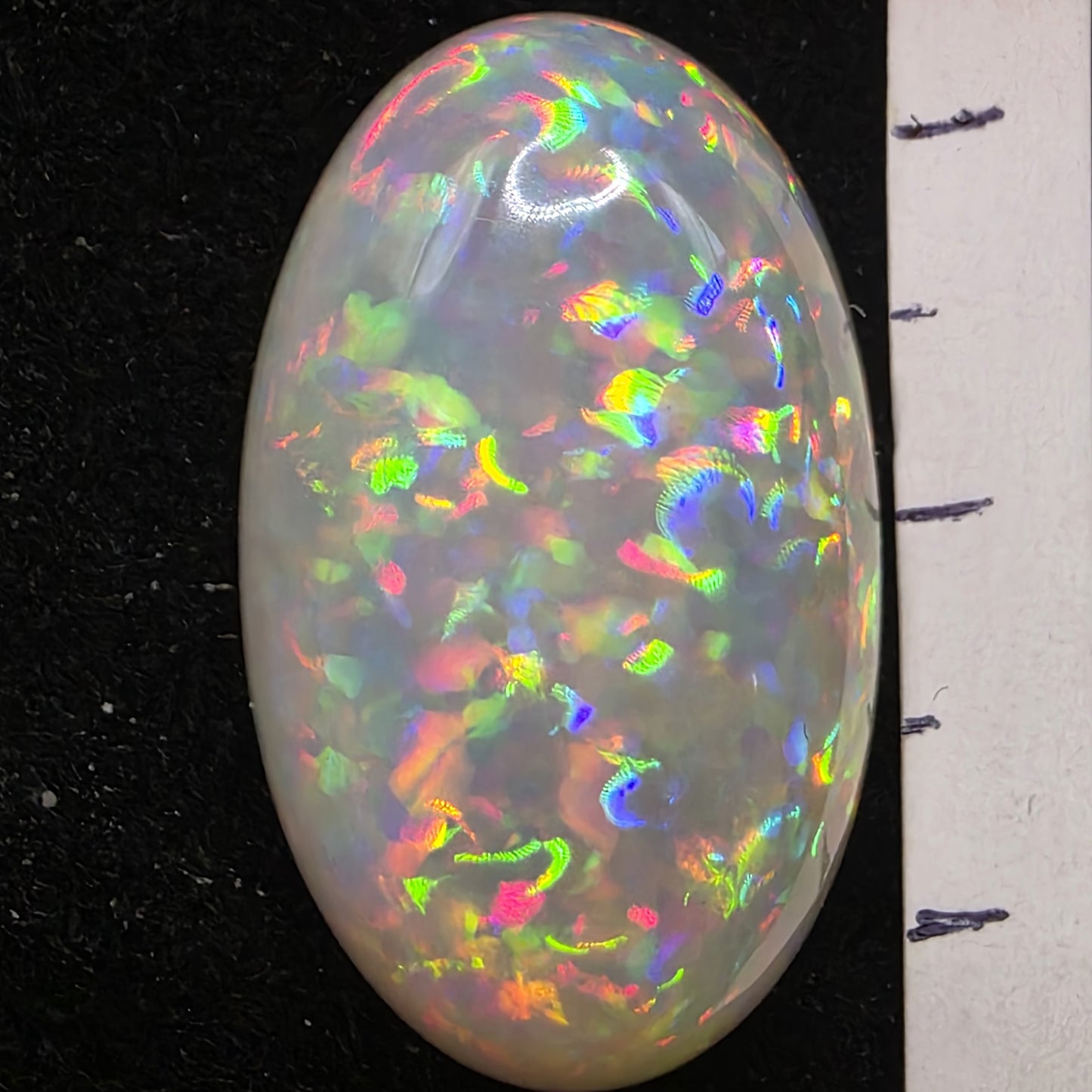 White Opal special Ethiopian Welo, 21 ct oval polished, natural, intense Play-of-Colour