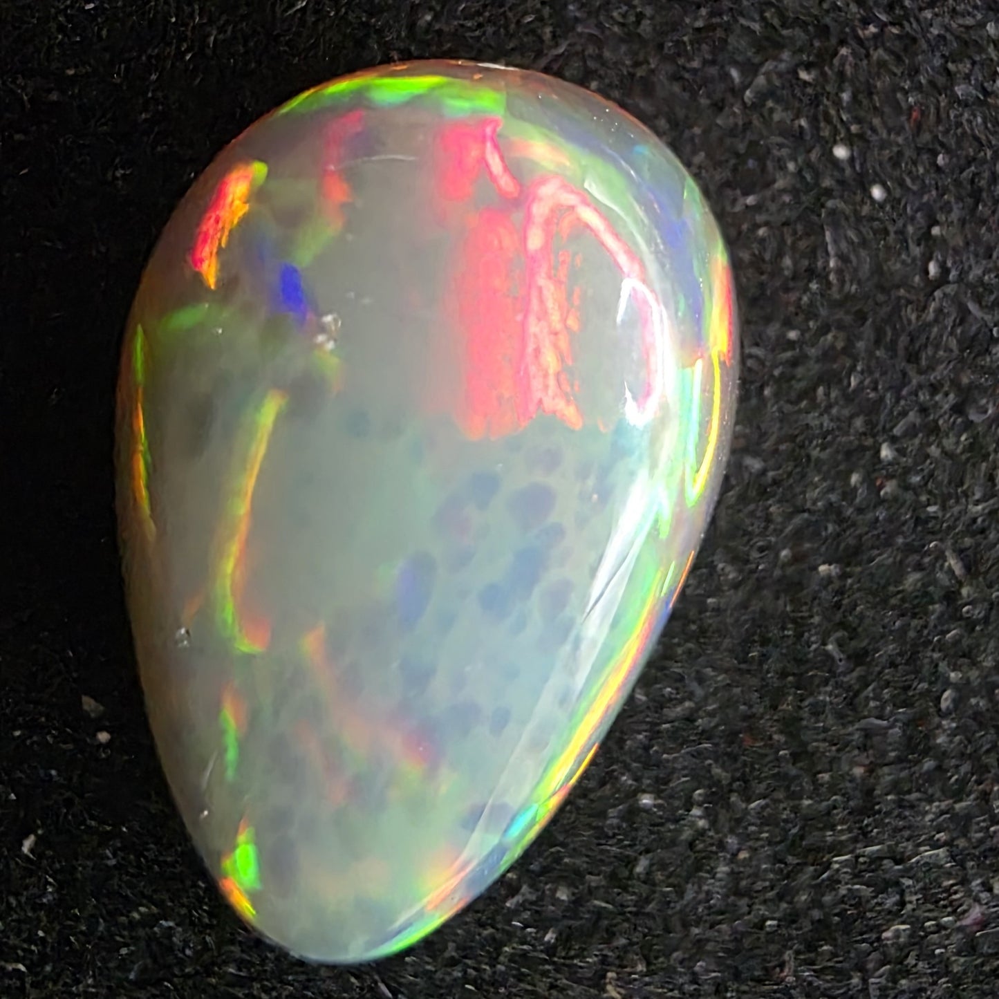 Black Opal special Ethiopian Welo, 4.1 ct pear polished, natural, intense Play-of-Colour