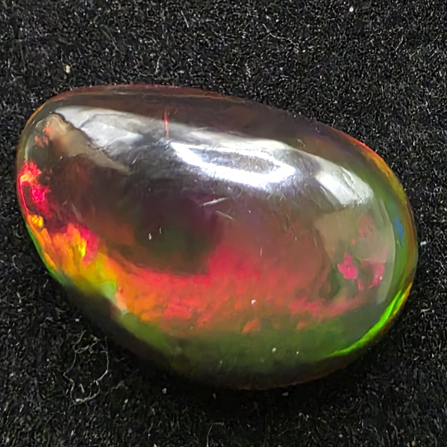 Black Opal special Ethiopian Welo, 5.45 ct freeform polished, natural, intense Play-of-Colour