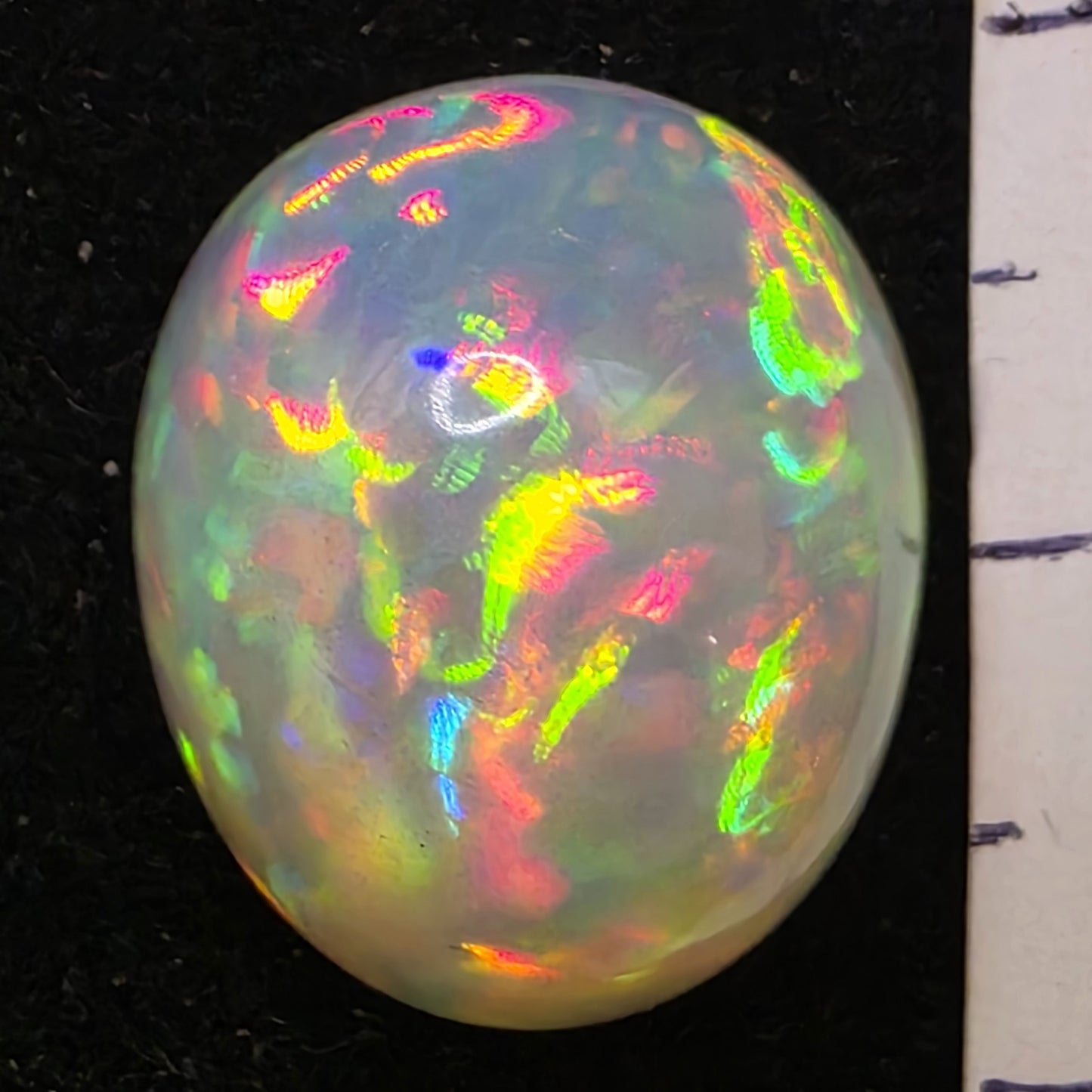 White Opal special Ethiopian Welo, 10.45 ct freeform polished, natural, intense Play-of-Colour