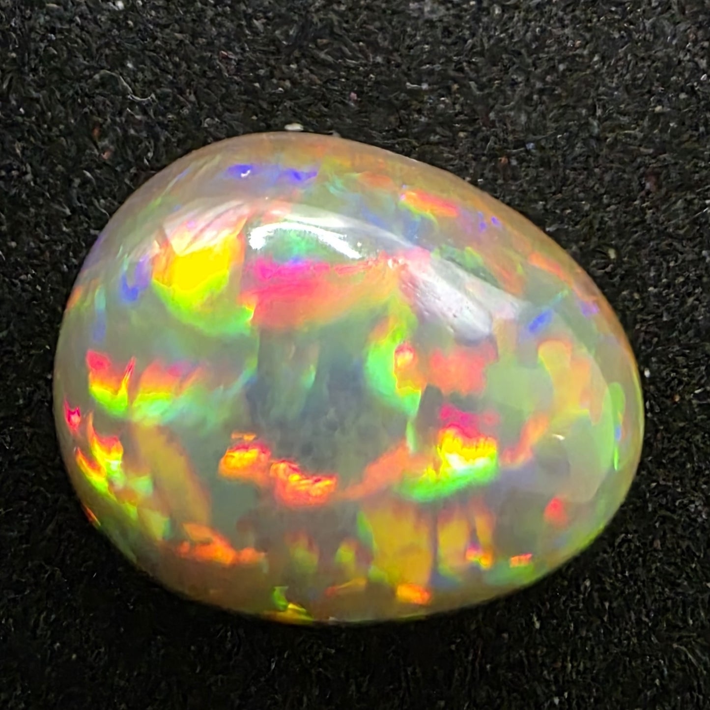 Black Opal special Ethiopian Welo, 5.7 ct pear polished, natural, intense Play-of-Colour