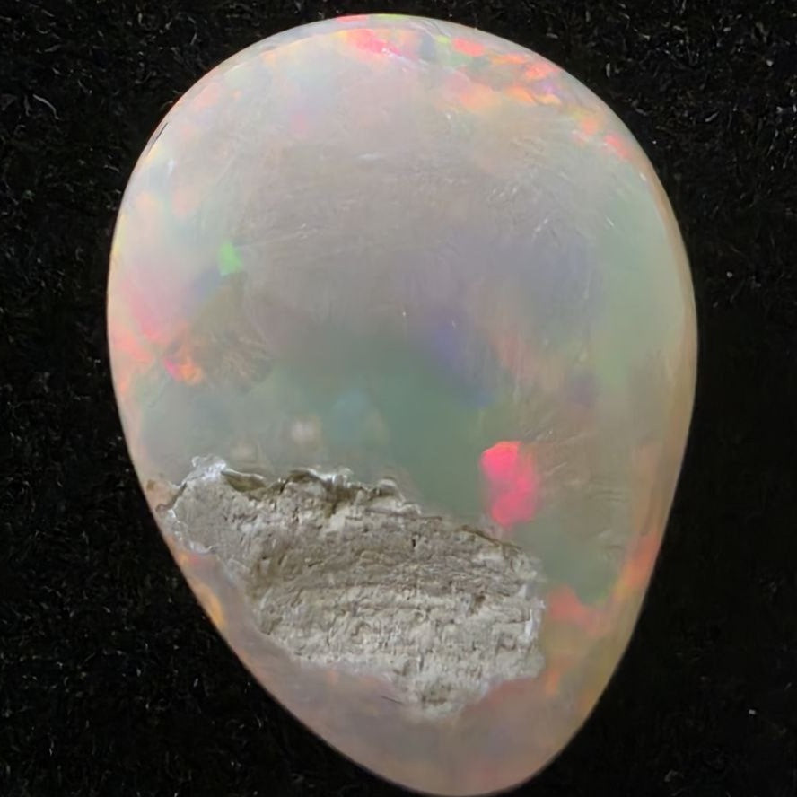 Black Opal special Ethiopian Welo, 4.25 ct pear polished, natural, intense Play-of-Colour