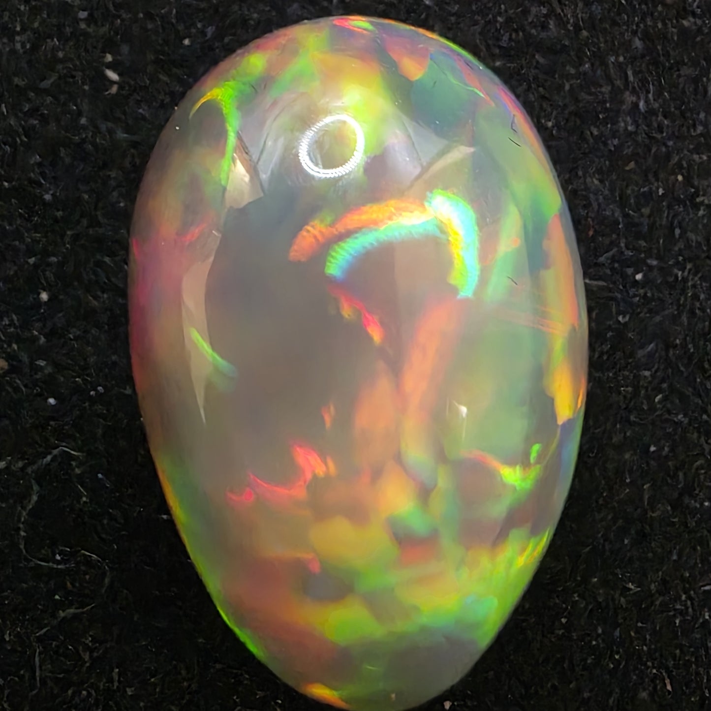 Black Opal special Ethiopian Welo, 9.45 ct pear polished, natural, intense Play-of-Colour