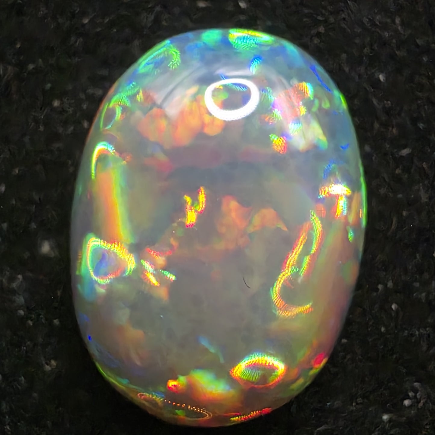 Black Opal special Ethiopian Welo, 5.4 ct oval polished, natural, intense Play-of-Colour