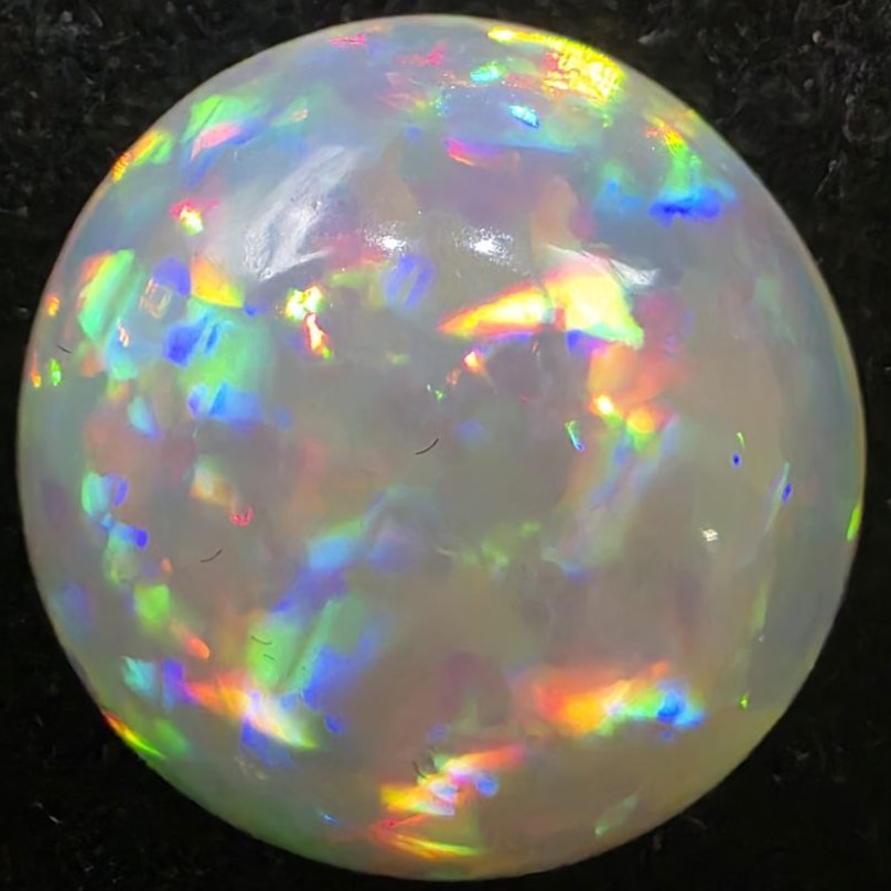 Black Opal special Ethiopian Welo, 5 ct round polished, natural, intense Play-of-Colour