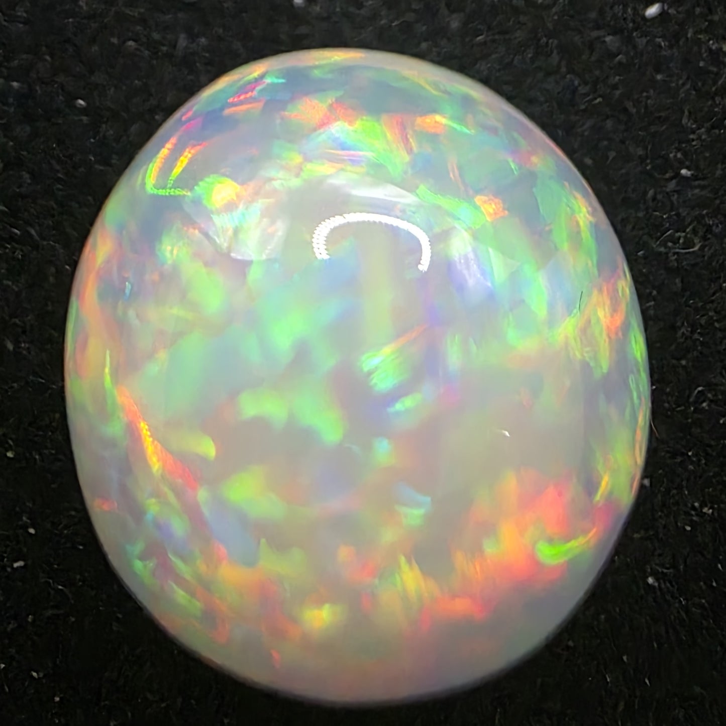 White Opal special Ethiopian Welo, 11.2 ct round polished, natural, intense Play-of-Colour