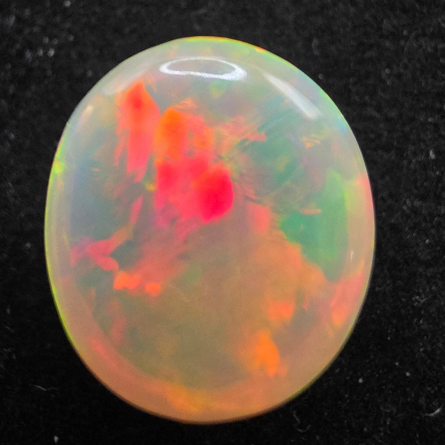 White Opal special Ethiopian Welo, 8.9 ct oval polished, natural, intense Play-of-Colour