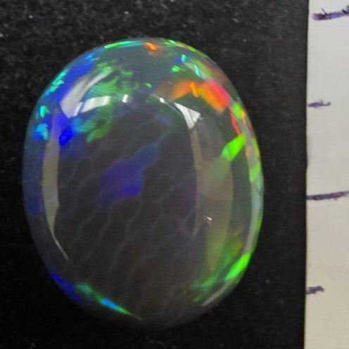 Black Opal special Ethiopian Welo, 6.65 ct oval polished, natural, intense Play-of-Colour