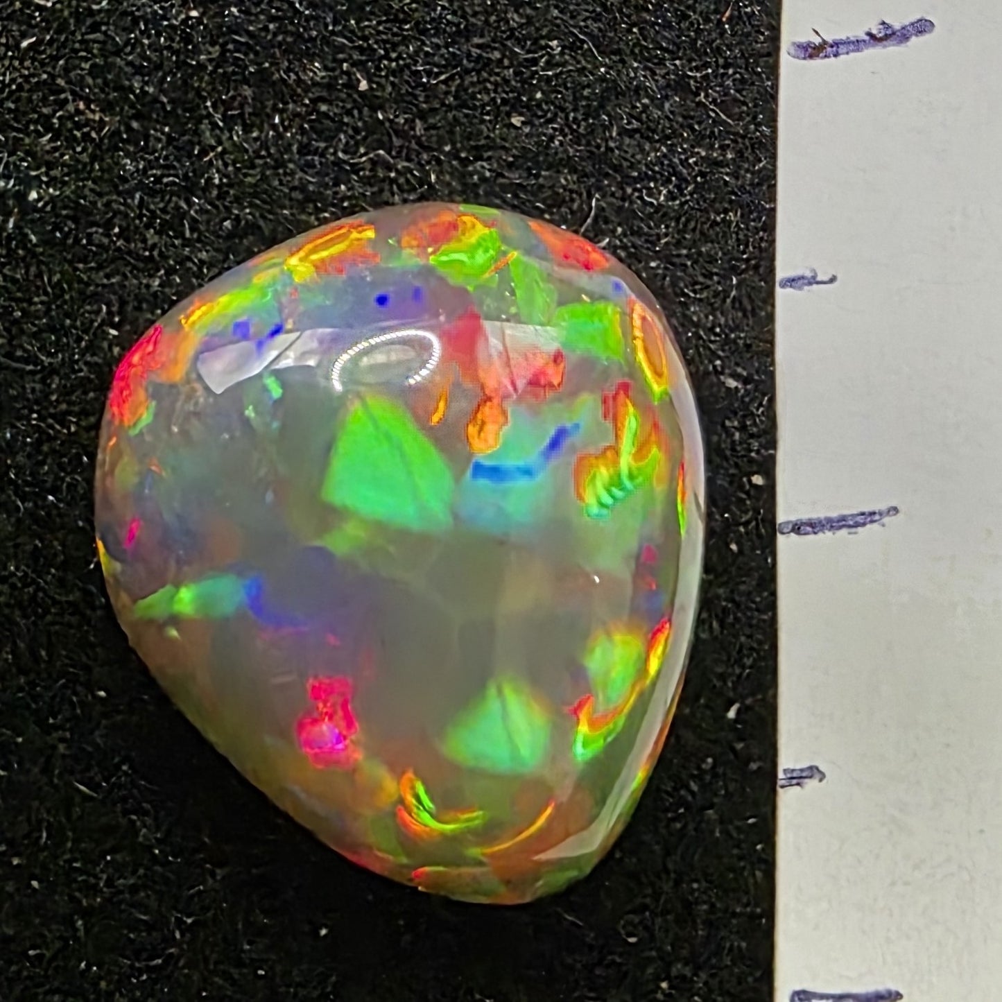 Black Opal special Ethiopian Welo, 5.6 ct pear polished, natural, intense Play-of-Colour