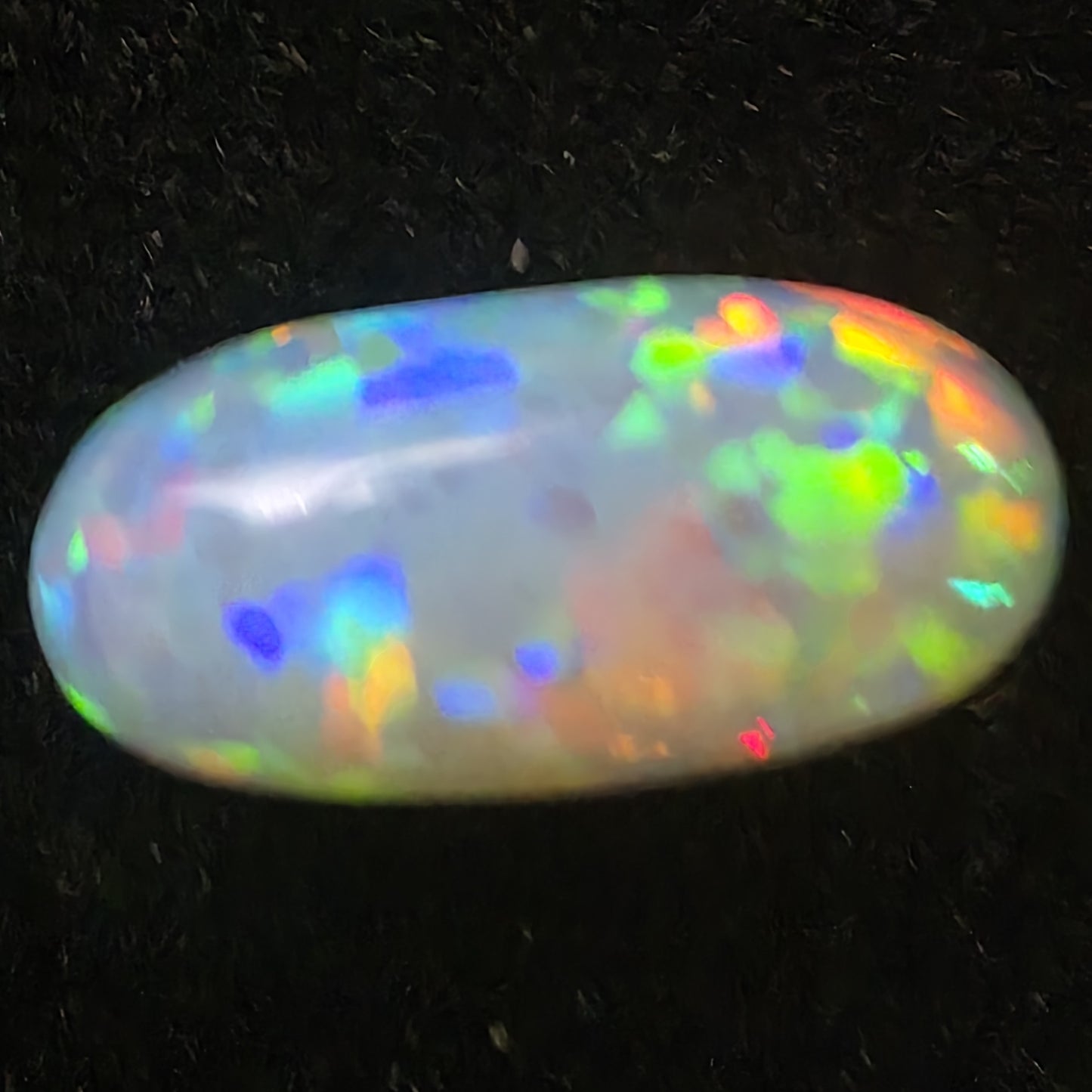 White Opal special Ethiopian Welo, 4.2 ct oval polished, natural, intense Play-of-Colour